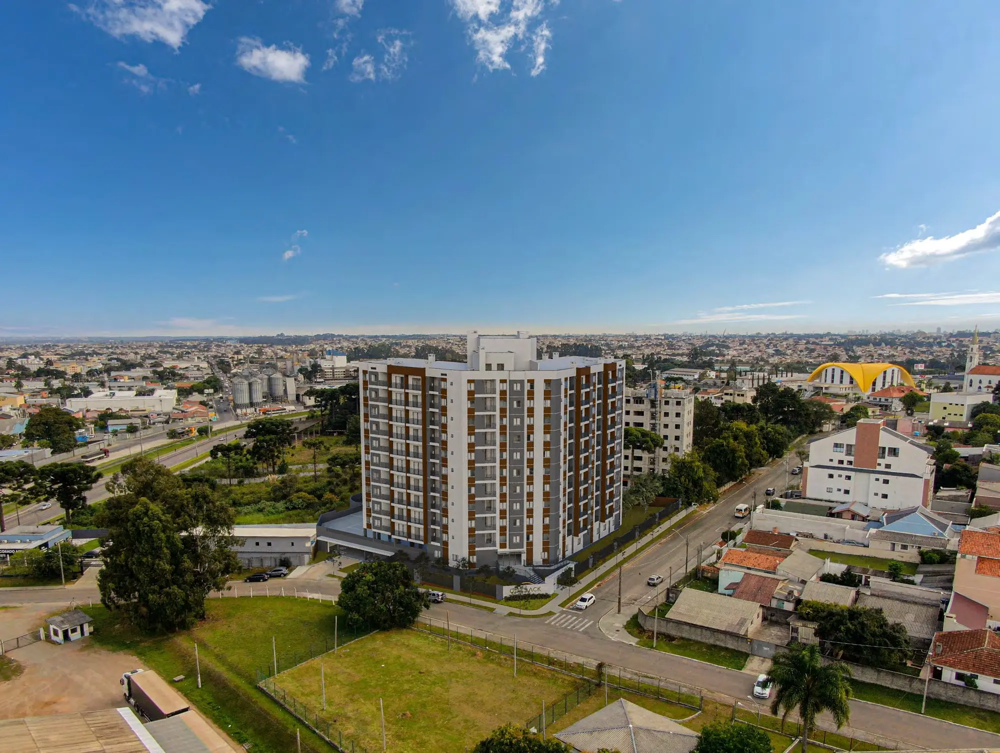 Vista aérea da torre e do bairro, render
