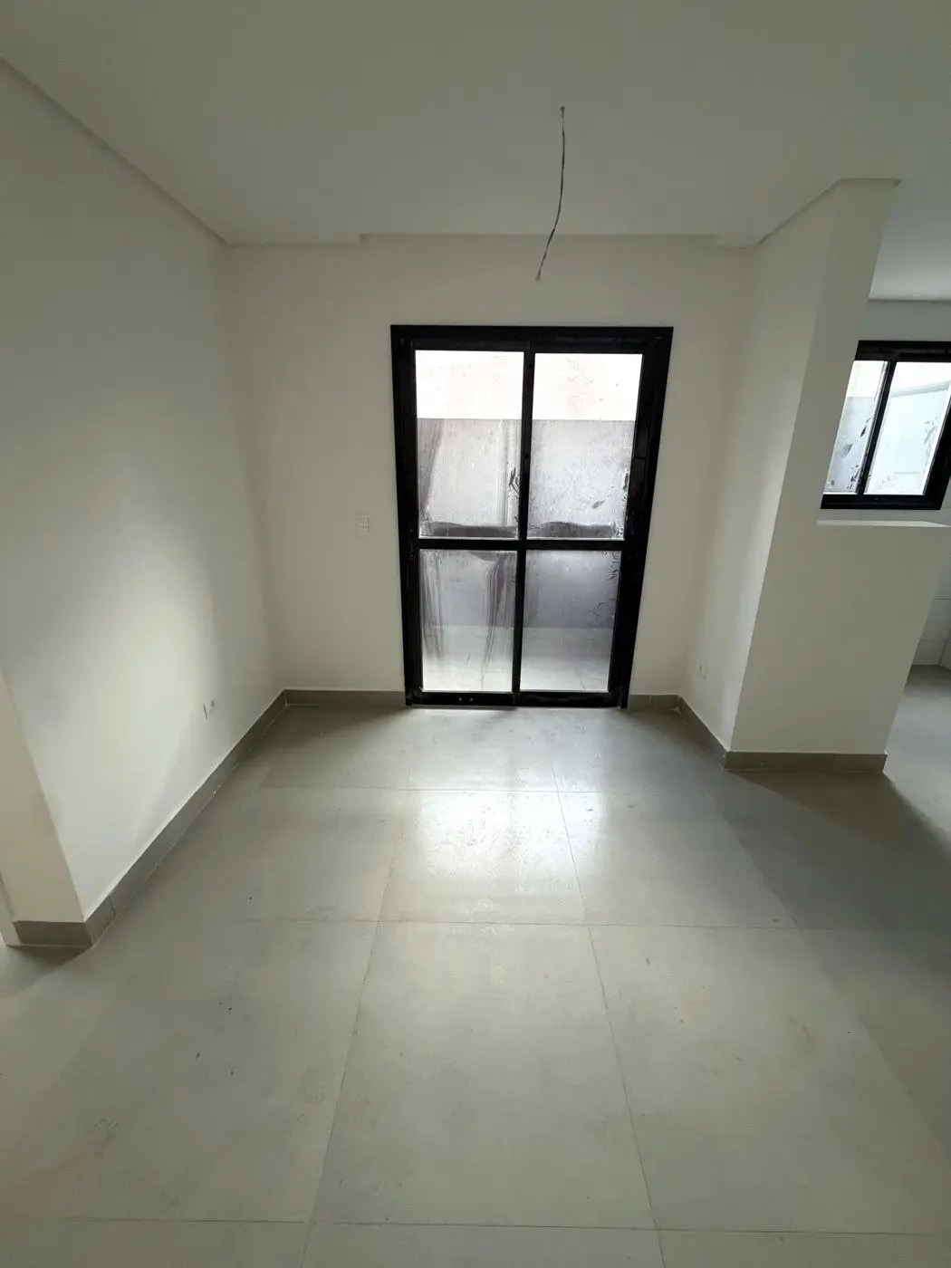 Sala com porta para o quintal